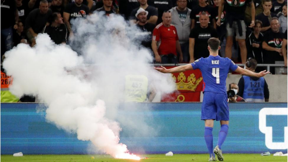 Objects, including a flare, were thrown on to the pitch in Budapest on Thursday