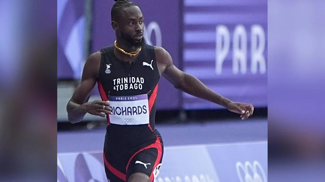 CONTROLLED RUN: Trinidad and Tobago’s Jereem “The Dream” Richards finishes second in his Olympic Games men’s 400 metres first round heat in 44.31 seconds at the Stade De France, in Paris, on Sunday. Richards will run in the semi-final round today. —Photo: BRENT STUBBS (Image obtained at trinidadexpress.com)